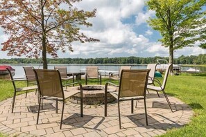 Fire pit area of Sunset Beach House with plenty of seating