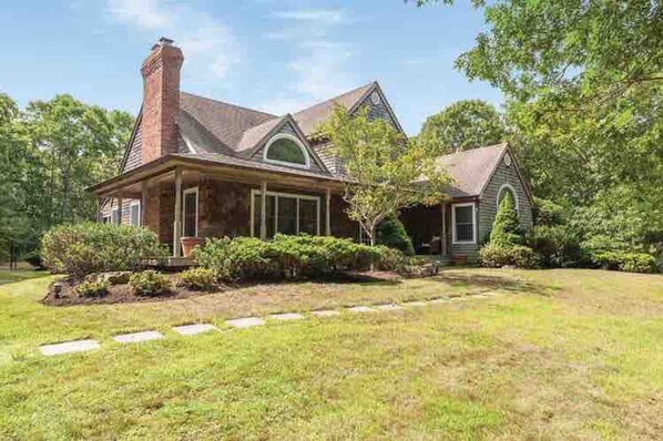 Traditional yet modern house is situated on 1.5 acres in prime East Hampton.