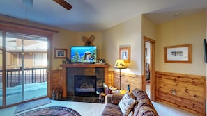 Living room with nearby kitchen and door to deck: Truckee Cinnabar Vacation Retreat