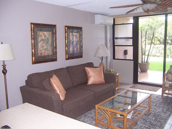 Open, airy, naturally lit living area, access to lanai,. pool, and beach.  