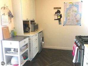 Kitchen area with washer