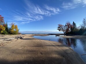 The private beach at the mouth of the Mineral River in fall