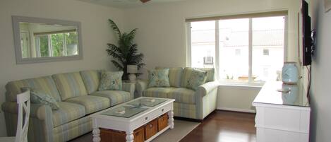 Living Room, ceiling fan, overhead lights, balcony, bamboo floors, smart TV