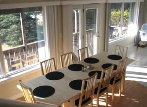 Large expandable dining table seats 12 and faces lake