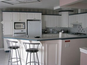Spacious kitchen fully loaded with all your cooking needs
