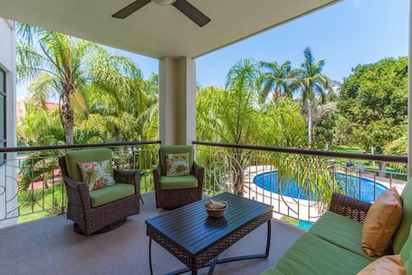Spacious balcony with barbeque, overlooking the gorgeous pool