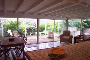 Dining area looking out on main lanai and tropical garden