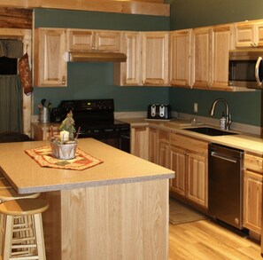 New countertop, cupboards and flooring.