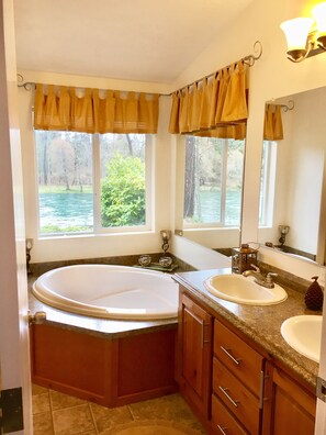 Master Bathroom has beautiful river view, large tub & seperate shower stall