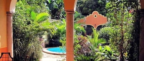 Covered Terrace Overlooking Pool and Garden