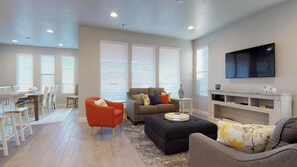 Main level family room featuring large screen tv