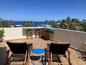 Chaise and bar on the private roof terrace