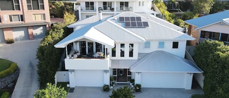 Front of home,  & showing top level - deck and sliding doors. Beds 5 & 6 