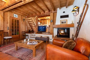 Spacious living room with a log fire