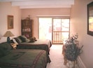 Upstairs large bedroom - Two queen beds, HD TV