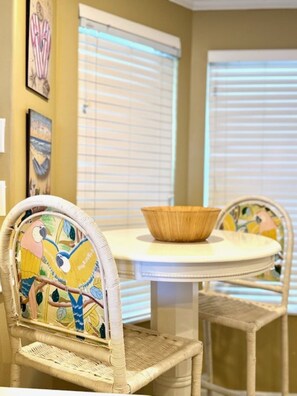 hi top table sitting area with view of bay 