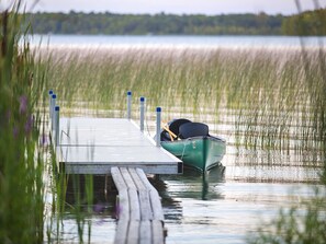 View of our dock with the canoe at dusk