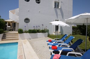 Spacious pool terrace area with lots of plants and a very private garden.