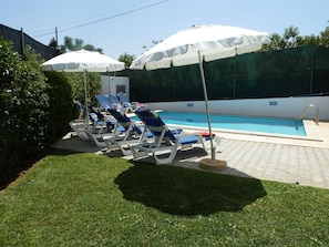 Enjoy the relaxing and private area by the sunny pool.