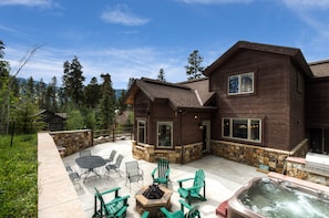 South side of house- fire pit, eating area, hot tub and gas grill