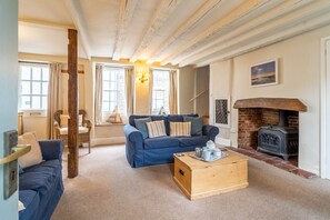36 High Street, Wells-next-the-Sea: Sitting room with wood burning stove