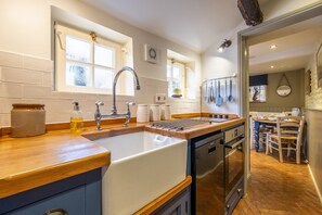 Ground floor: Galley kitchen with ceramic butler sink