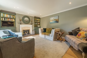 Ground floor: Sitting room with a feature fireplace and comfortable seating