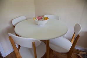 Ground floor: Dining table with seating for four