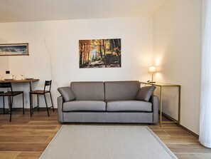 Furniture, Couch, Interior Design, Flooring, Floor, Table, Living Room, Room, Lighting