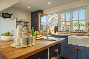 Marigold Cottage  - The country kitchen with wooden worktops and a butlers sink