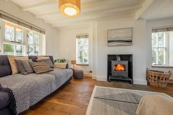 Marigold Cottage - Stylish, relaxing sitting room with a wood burning stove and plenty of comfy seating
