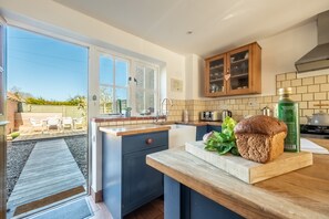 Marigold Cottage  -Bright kitchen with views looking over the fully enclosed garden