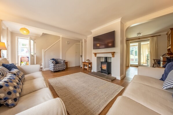 Winchelsea, Brancaster: Sitting room with wood burning stove