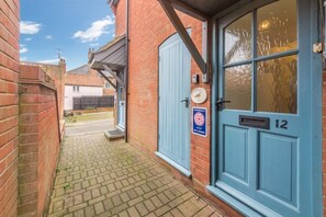 Entrance to Curlew Apartment, set down a quiet street just off the harbour