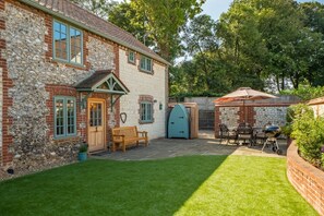 Pine Cottage, Thornham: Garden with artificial lawn and dog shower