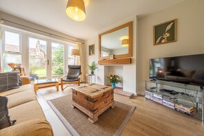 Holly House, Wells-next-the-Sea: The sunny sitting room overlooks the south facing rear garden
