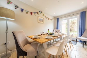 Holly House, Wells-next-the-Sea: Dining room with french doors to the rear garden