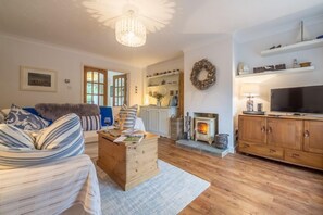 Ground floor: The sitting room has wood burning stove