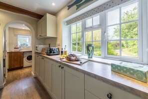 Ground floor: The kitchen has utility room beyond