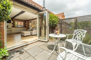 The Old Cow Shed, Pott Row: Bi-fold doors to courtyard garden