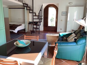 Double bed and steps to mezzanine (single bed on mezzanine)