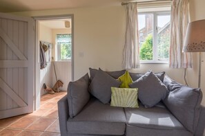 Ground floor:  Sitting/dining room with comfy sofa