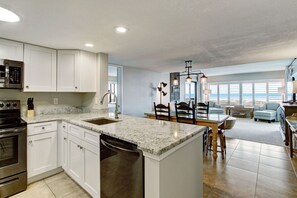 Upgraded Kitchen Featuring Granite Countertops and New Stainless Steel Appliances