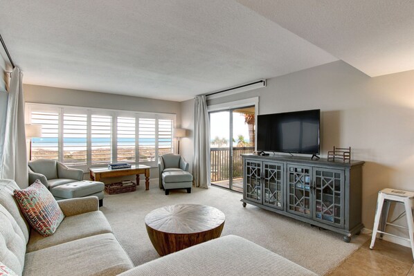 Newly Updated Amelia Surf and Racquet Club Villa! Living Area with Sofa, Two Chairs and Access to Two Covered Balconies