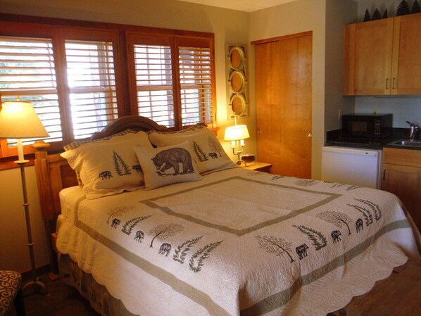 Queen bed with wet bar, coffee maker, microwave and mini refrigerator.