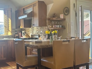 Sandstone table w 4 leather high top chairs