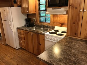 Full kitchen including dishwasher and ice maker