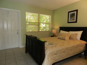 "Seafoam" green apartment bedroom with queen bed