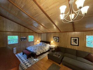 Master bedroom with king and sofa
