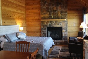 King Memory foam bed in main area.  TV is on mantel above fireplace (not shown)